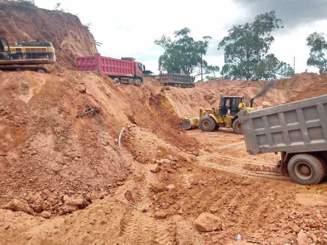 Earthmoving machinery working on a prepared construction site