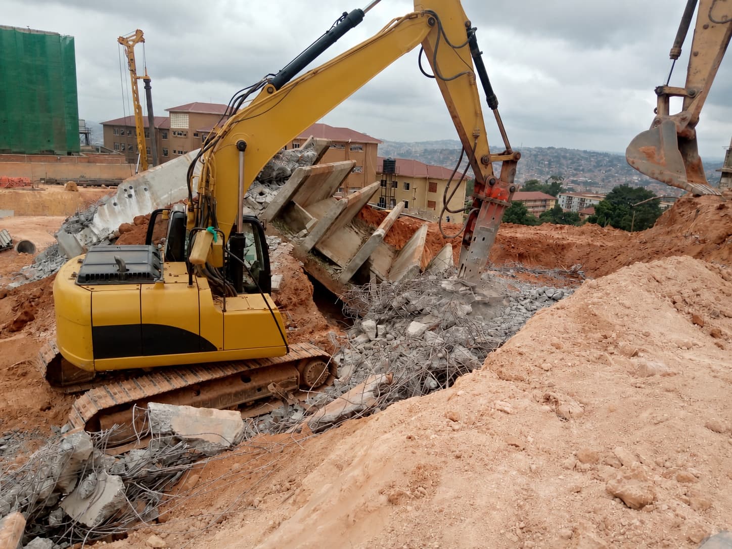 Hydraulic breaker dismantling reinforced concrete elements