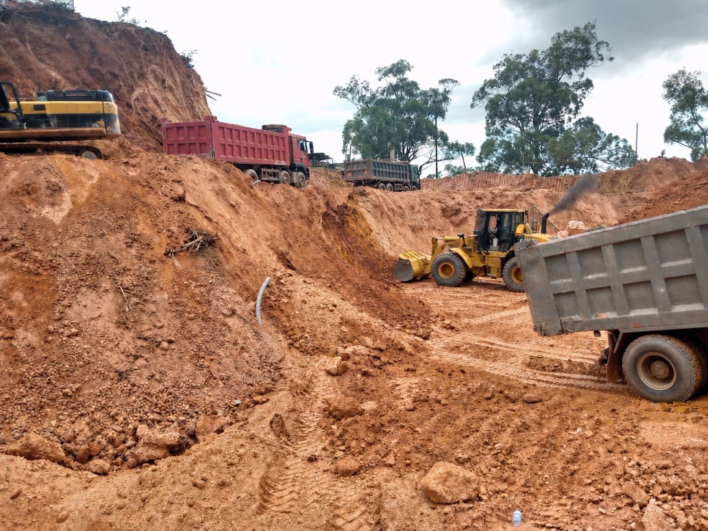 Excavation fleet working across a large earthworks site