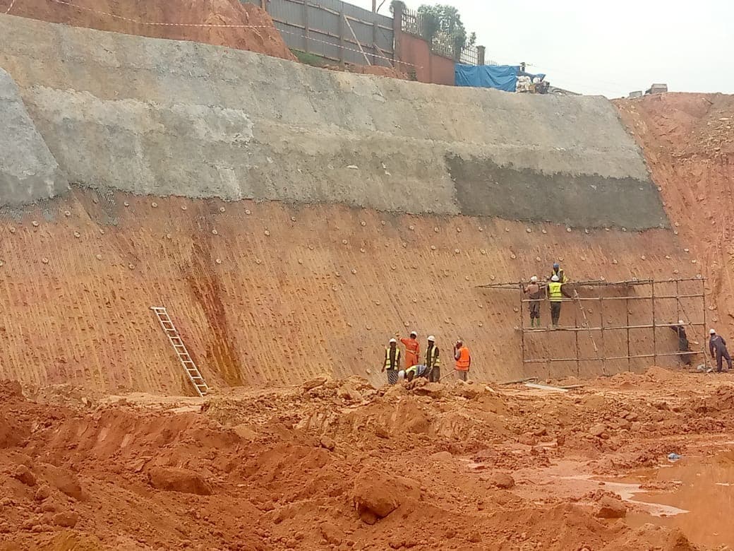 Site team preparing an excavated slope for stabilisation