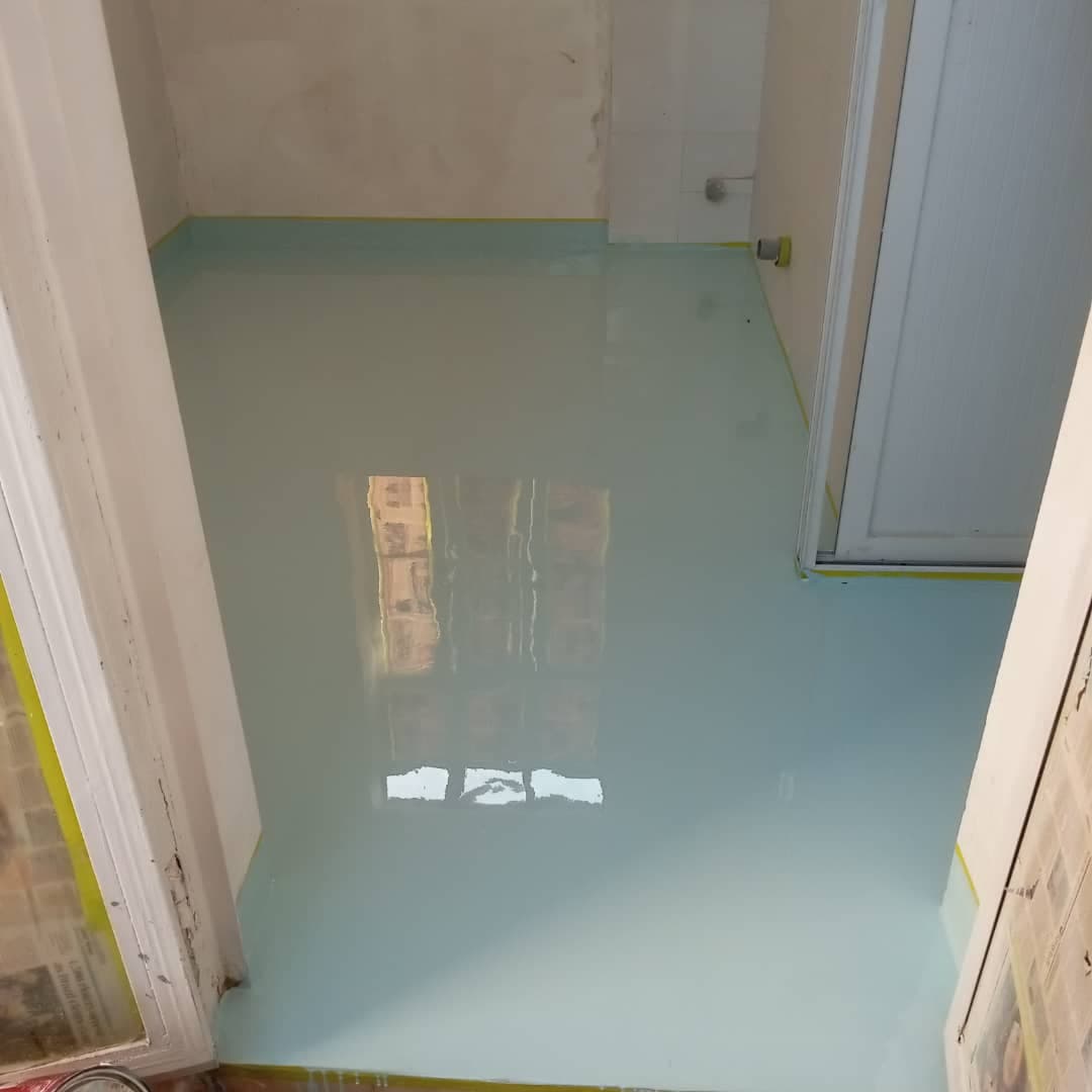 Light blue epoxy floor coating finished with integrated coved skirting