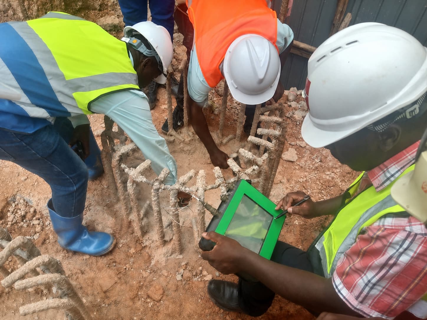 Site engineers carrying out pile integrity testing