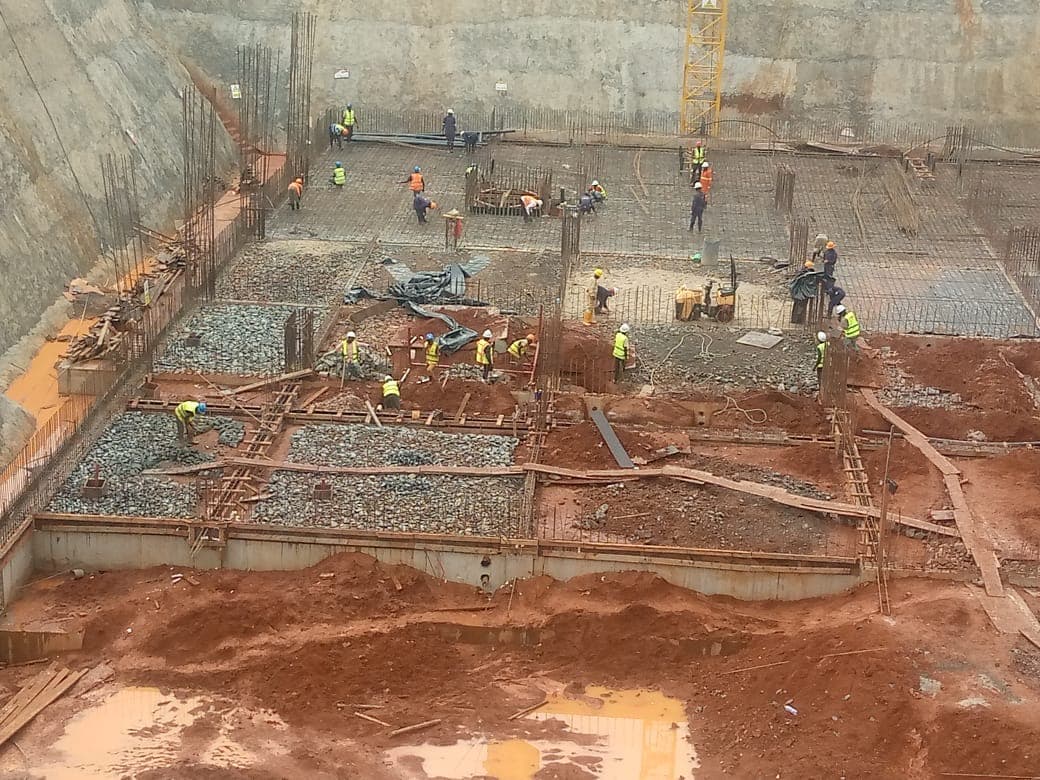 Teams preparing a reinforced concrete foundation